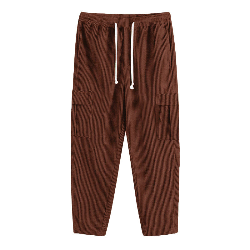 Men's corduroy jogger-style pants with elastic drawstring waistband, flap cargo pockets, and tapered leg StylebySassy