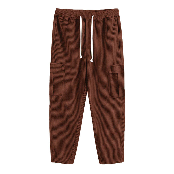 Men's corduroy jogger-style pants with elastic drawstring waistband, flap cargo pockets, and tapered leg StylebySassy