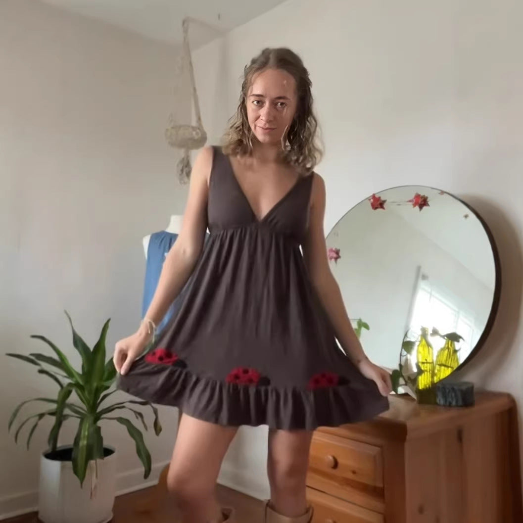 Women's short strap dress with deep V-neck, empire waist, and ladybug embroidery StylebySassy