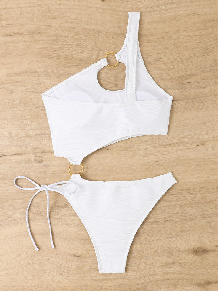Women's one-piece swimsuit with asymmetrical cut-out and golden accents StylebySassy