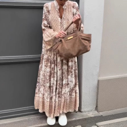 Ladies' tiered maxi dress with ethnic border, stand-up collar, and wide bell sleeves StylebySassy