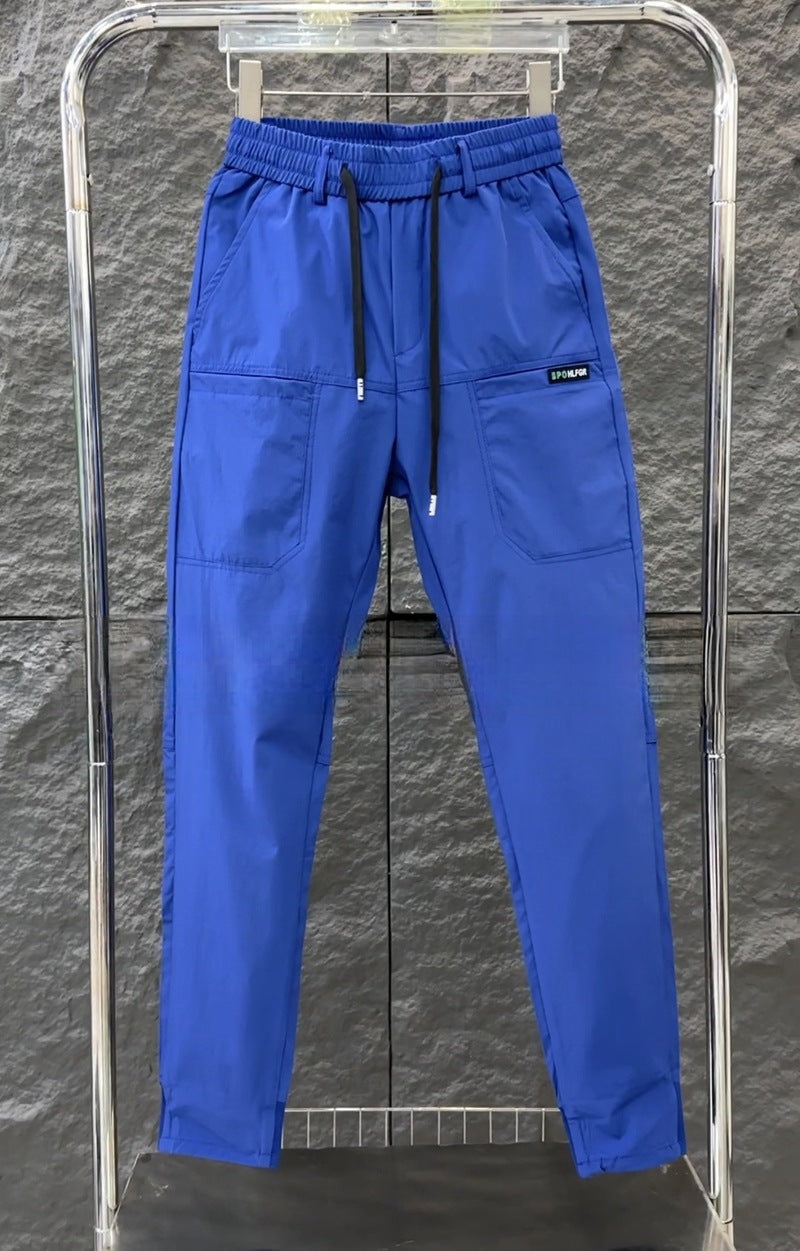 Men's sporty cargo jogger pants with elastic waistband, drawstring, and tapered leg hem StylebySassy
