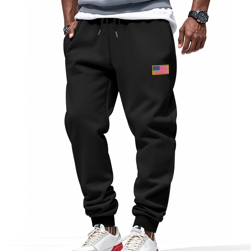 Men's slim-fit sweatpants with tapered leg, elastic drawstring waistband, and discreet flag application StylebySassy