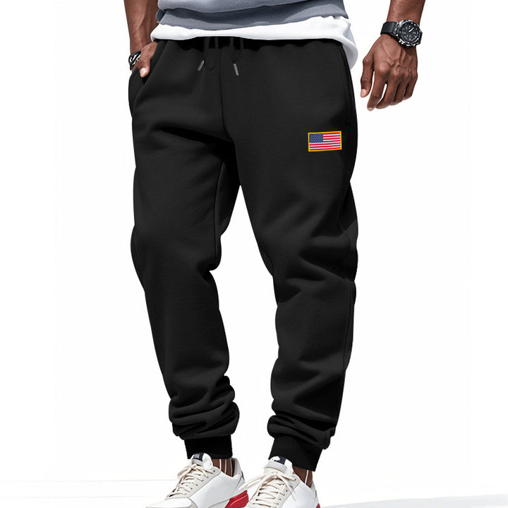Men's slim-fit sweatpants with tapered leg, elastic drawstring waistband, and discreet flag application StylebySassy