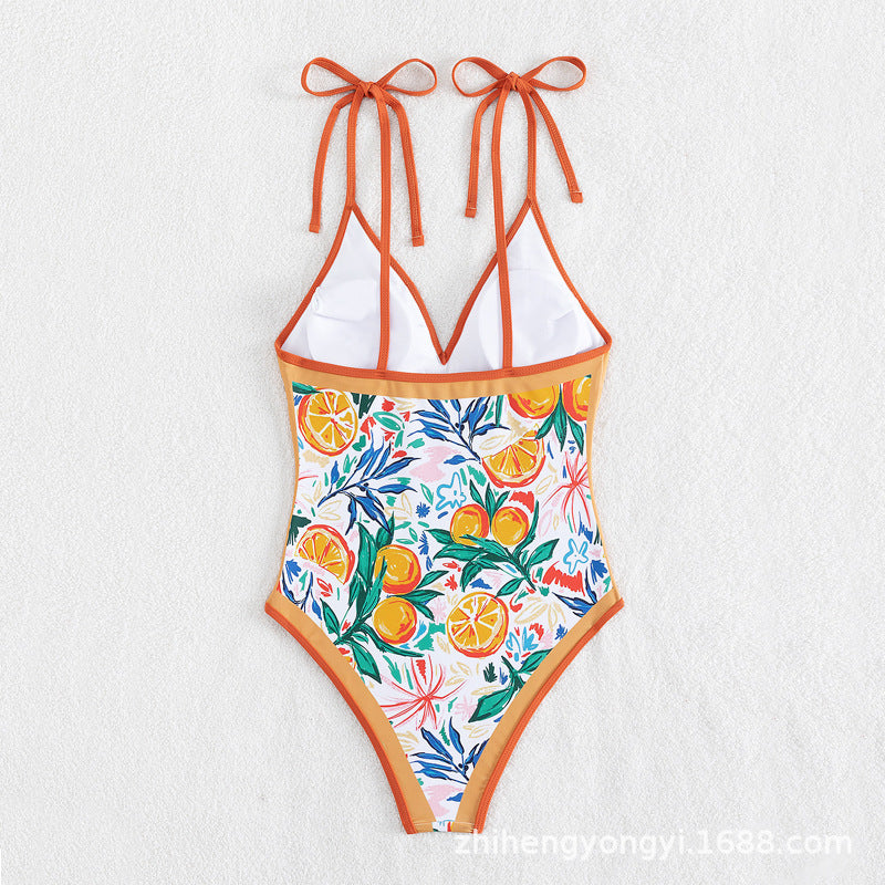 Women's swimsuit with vibrant plant and fruit motif StylebySassy