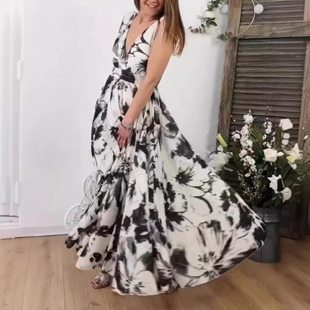Women’s voluminous A-line maxi dress with deep V-neck, tailored tie belt and large floral brush print StylebySassy