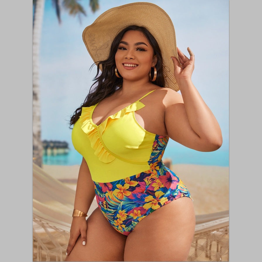 Women's one-piece swimsuit with asymmetrical ruffle design and floral pant area StylebySassy