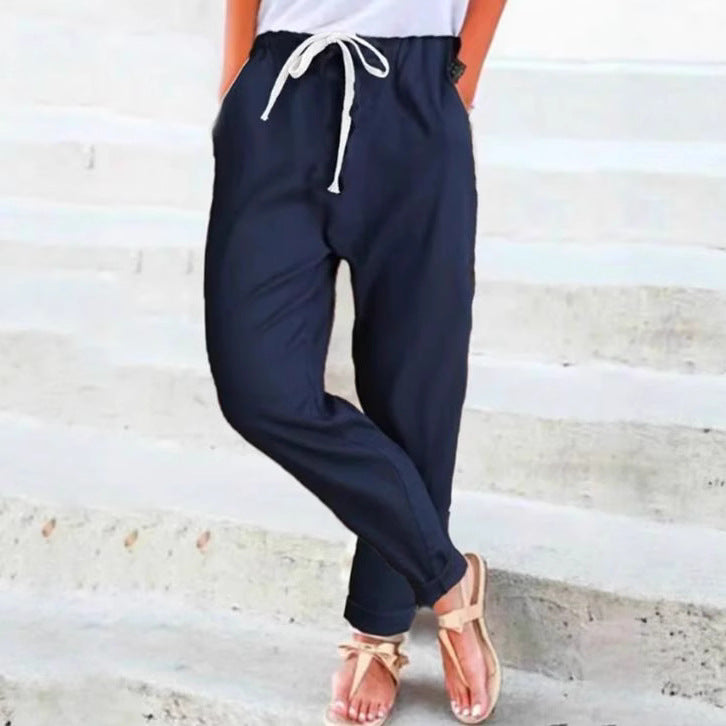Women's light linen blend pants with elastic waistband, drawstring, and tapered ankle section StylebySassy
