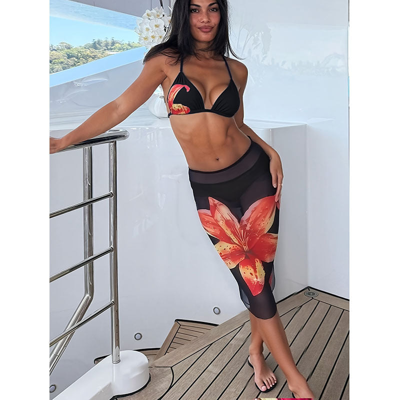 Women's bikini set with floral accents and form-fitting skirt StylebySassy