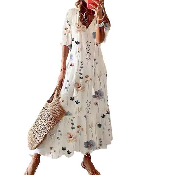 Women’s airy maxi dress in A-line with V-neck, casual rolled sleeves and floral all-over print StylebySassy