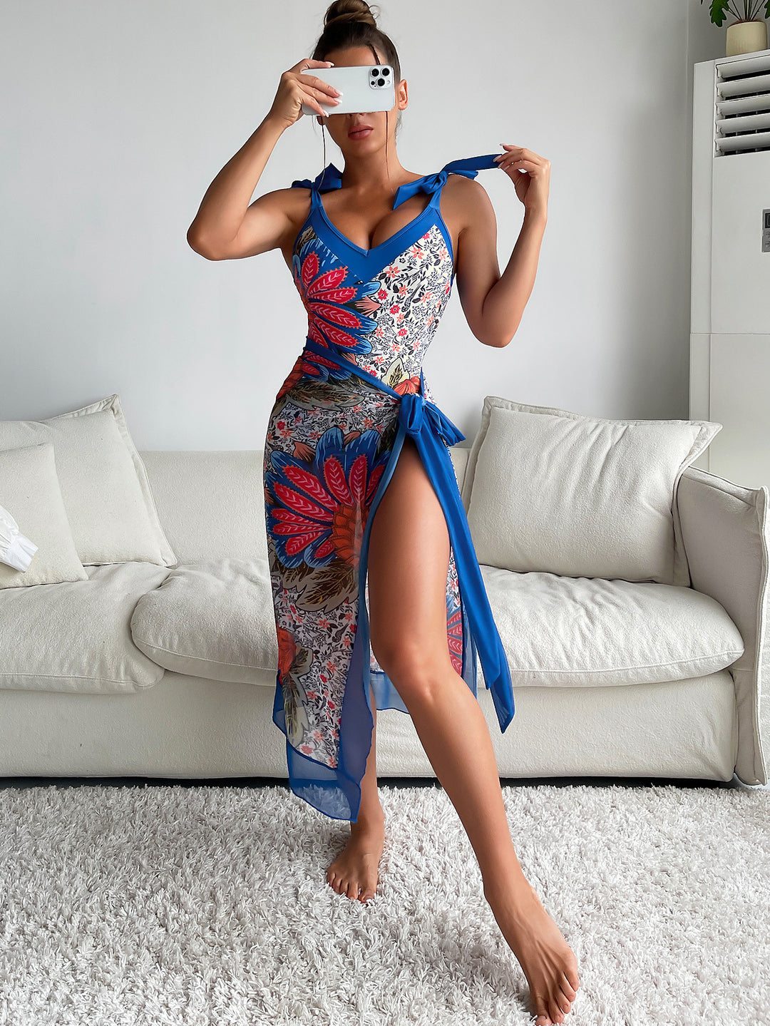 Women's one-piece swimsuit with playful floral design and stylish wrap skirt StylebySassy