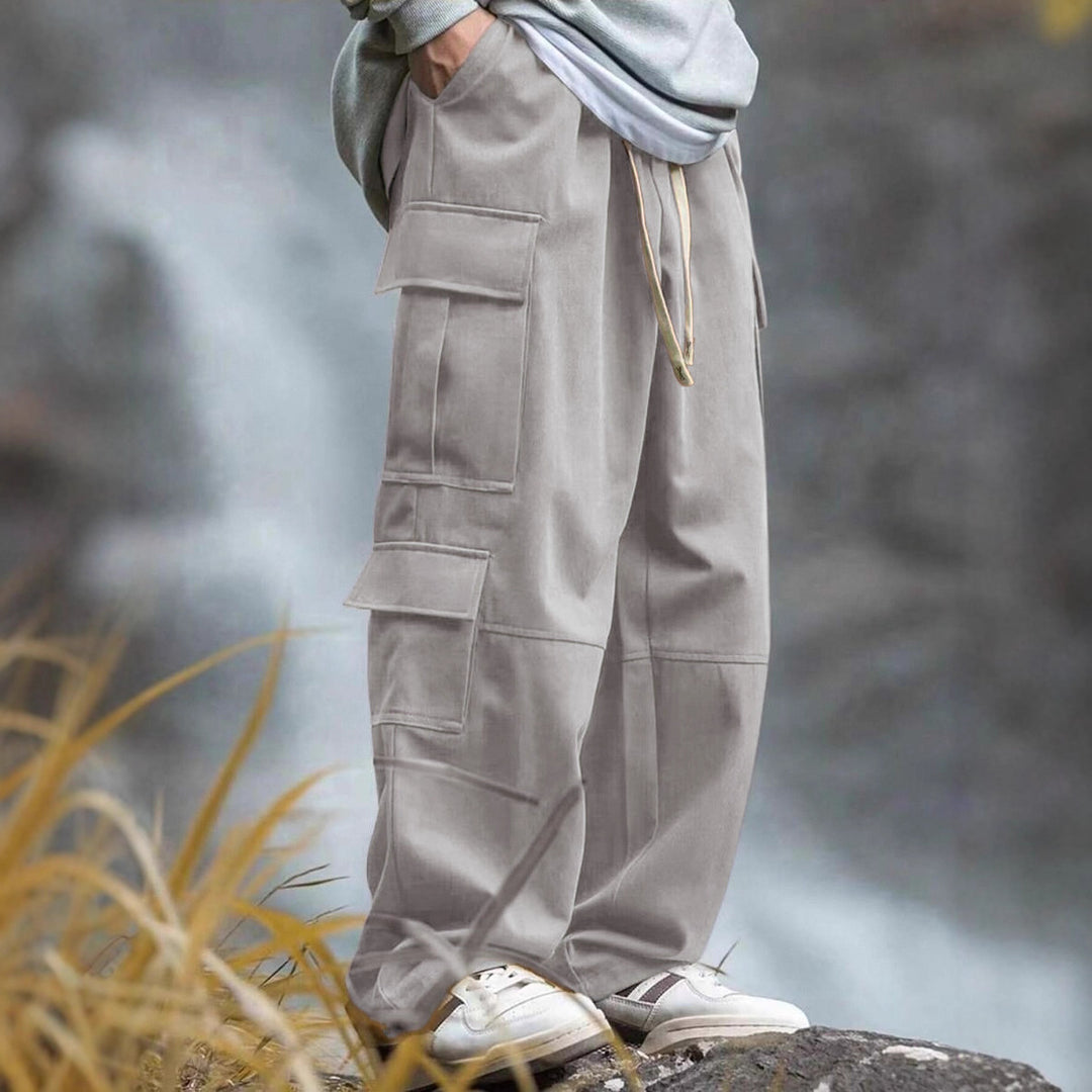Men's casually cut multiple pockets cargo pants with wide leg and prominent knee darts StylebySassy