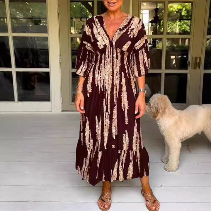 Ladies' V-neck maxi dress with brushstroke pattern, gathered underbust, balloon sleeves, and ruffled tiers StylebySassy