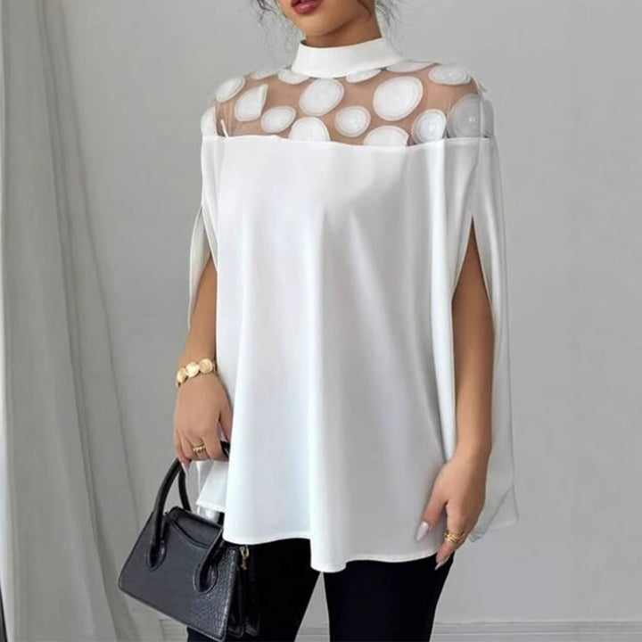 Women’s loose-fitting blouse with transparent round appliqué insert and cape sleeves StylebySassy