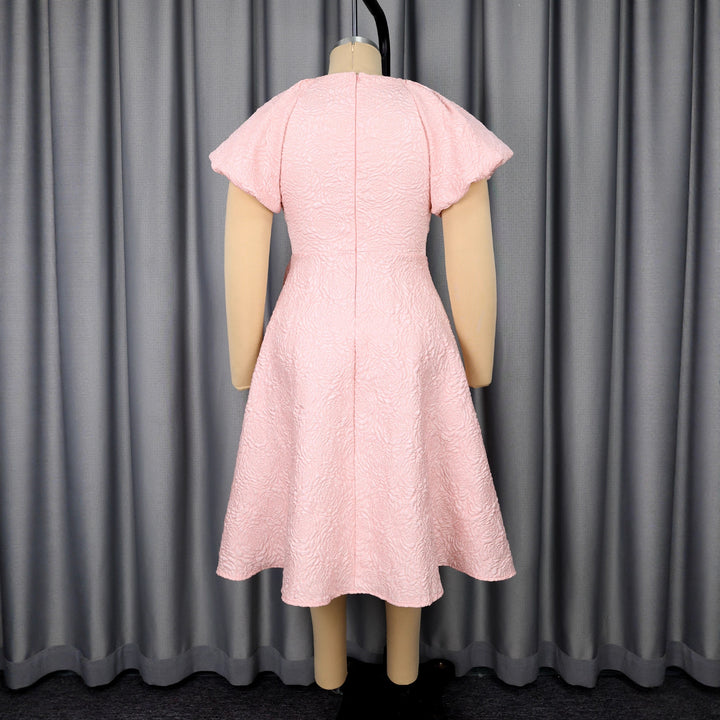 Ladies elegant dress with peplum, floral applique and puff sleeves StylebySassy