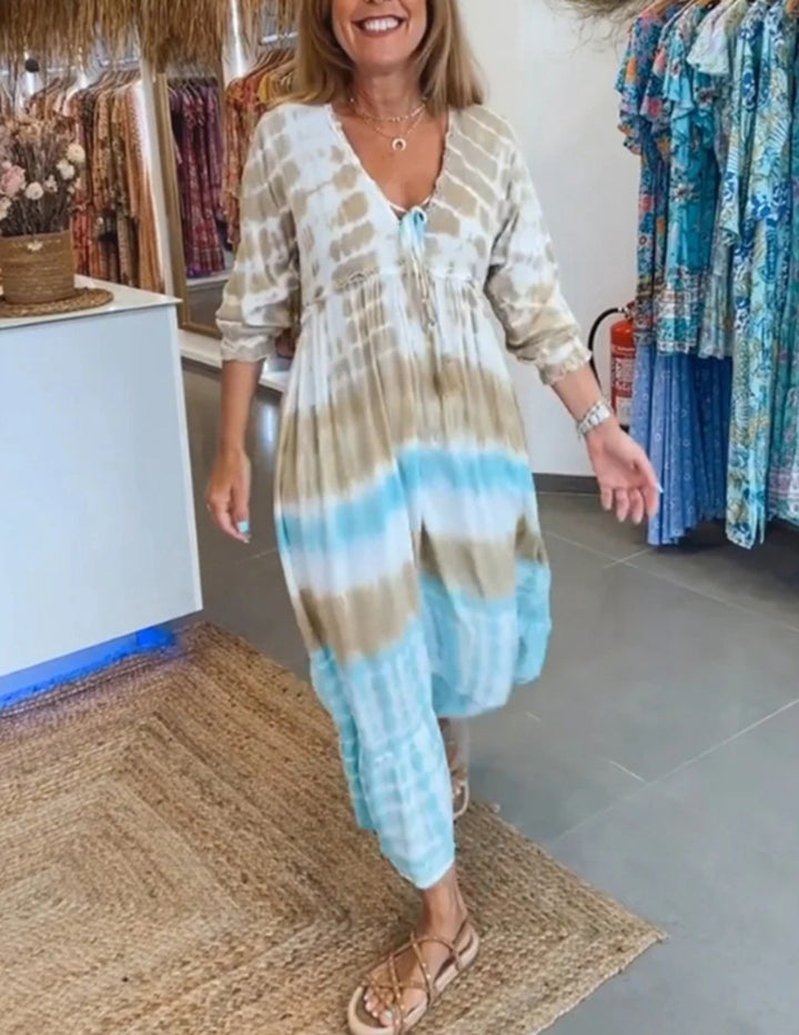 Women's airy batik tiered dress with V-neck, empire waist, and elastic sleeves StylebySassy