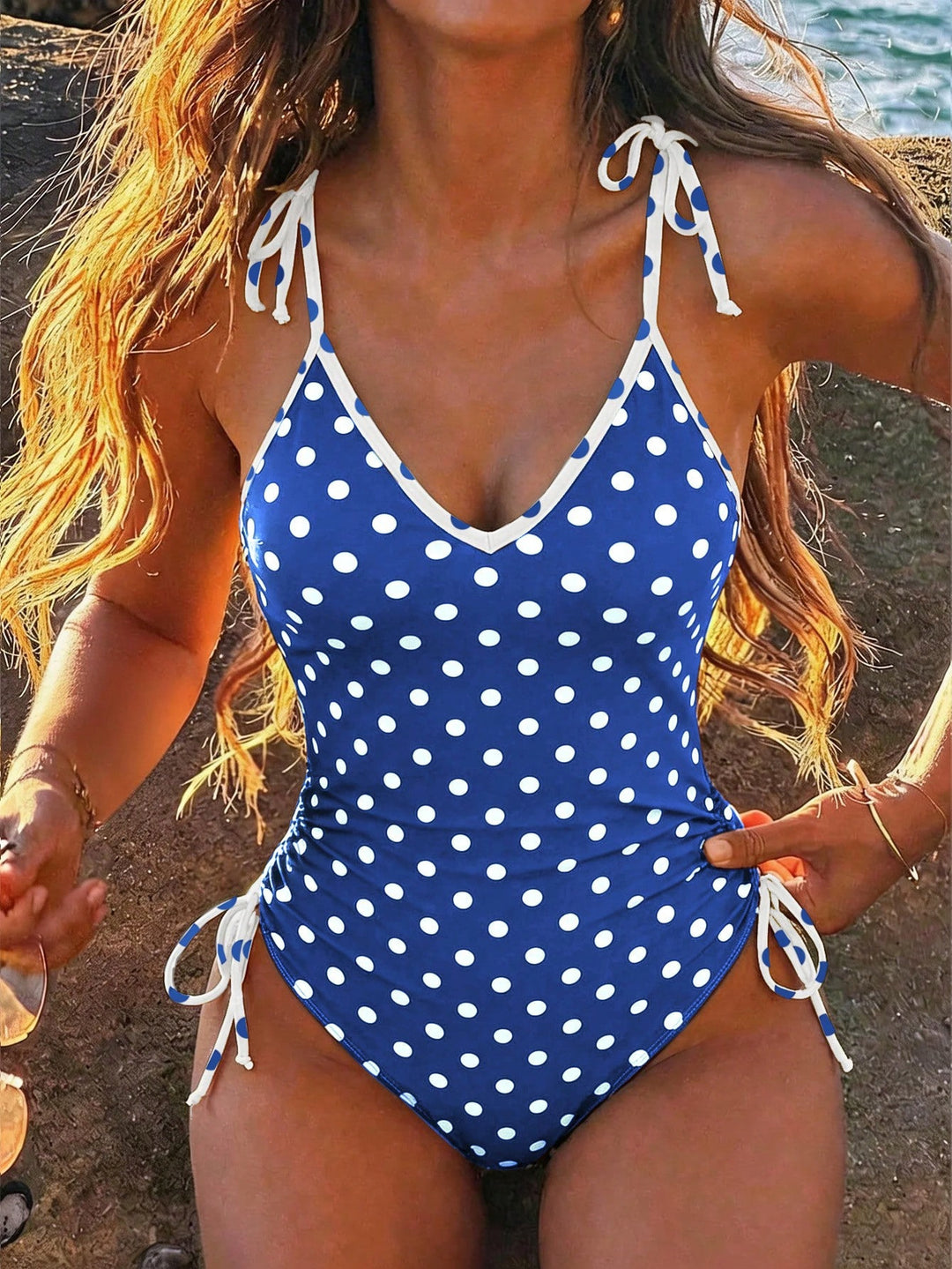 Women's one-piece swimsuit with playful polka dot design StylebySassy