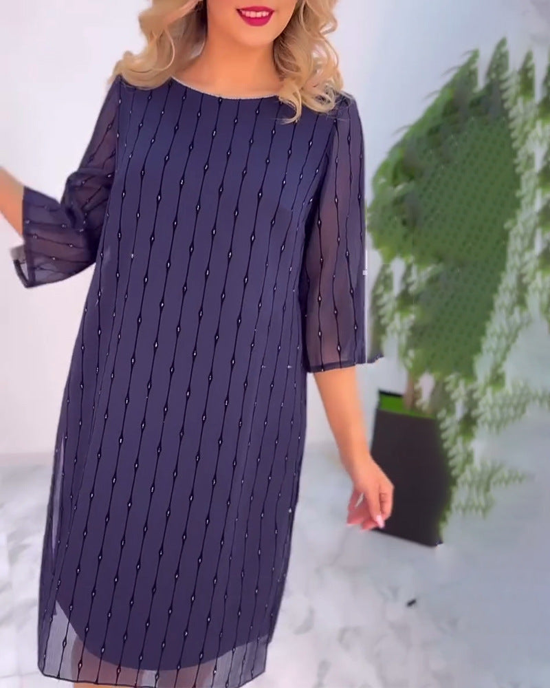 Ladies elegant chiffon midi dress with vertical sequin and bead appliqué as well as transparent three-quarter sleeves StylebySassy