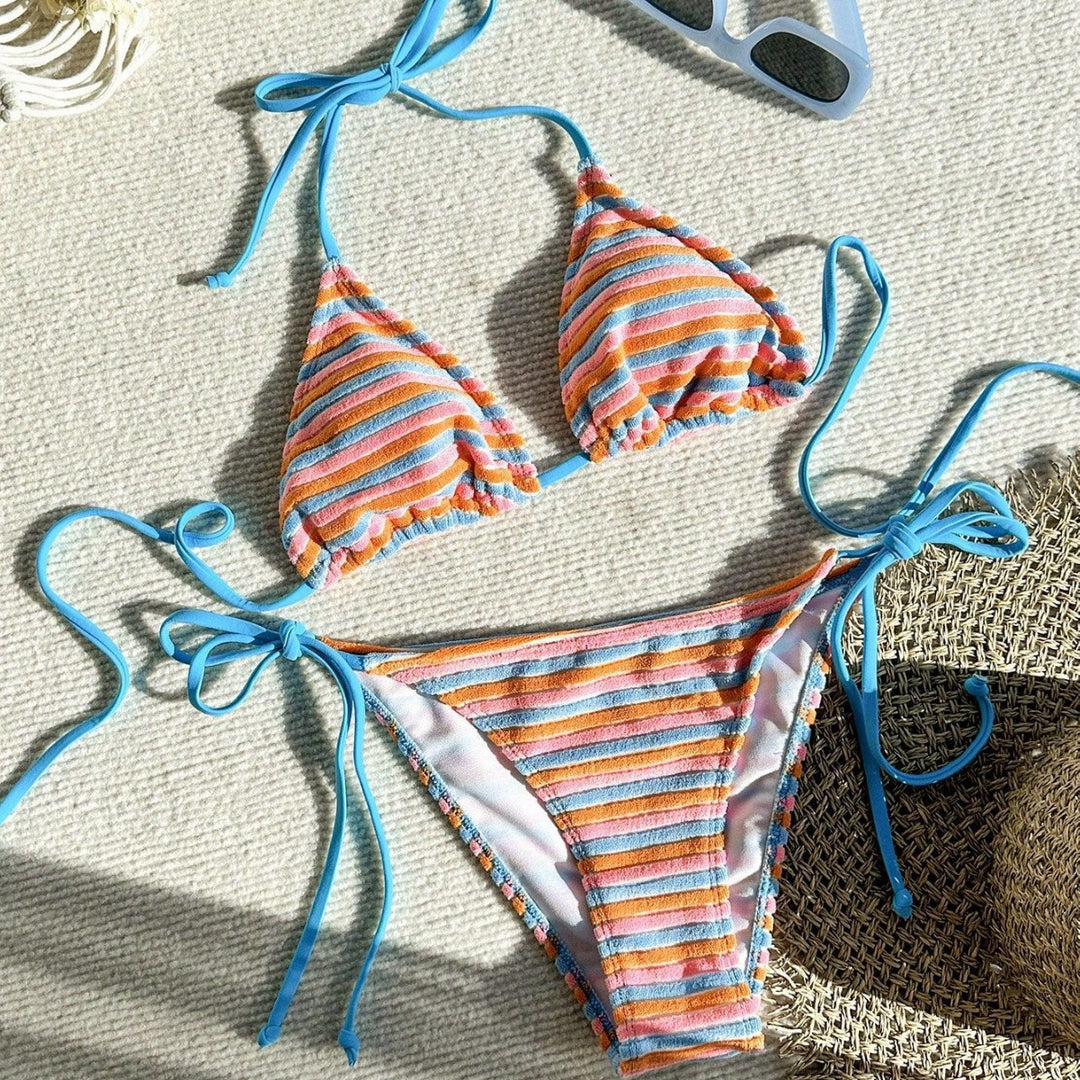 Women's bikini model with playful striped pattern StylebySassy