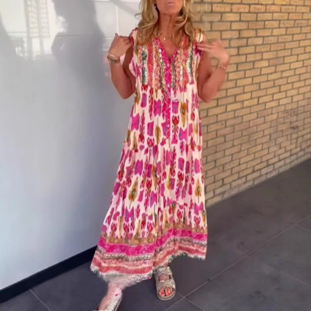 Ladies' flowing maxi dress in boho style with V-neck, tiered skirt and embroidered yoke StylebySassy