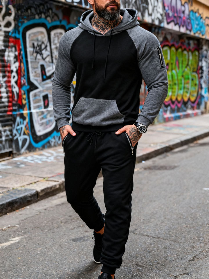 Men's two-piece hooded sweat set with raglan sleeves, sleeve zip pocket, and tapered jogging pants StylebySassy