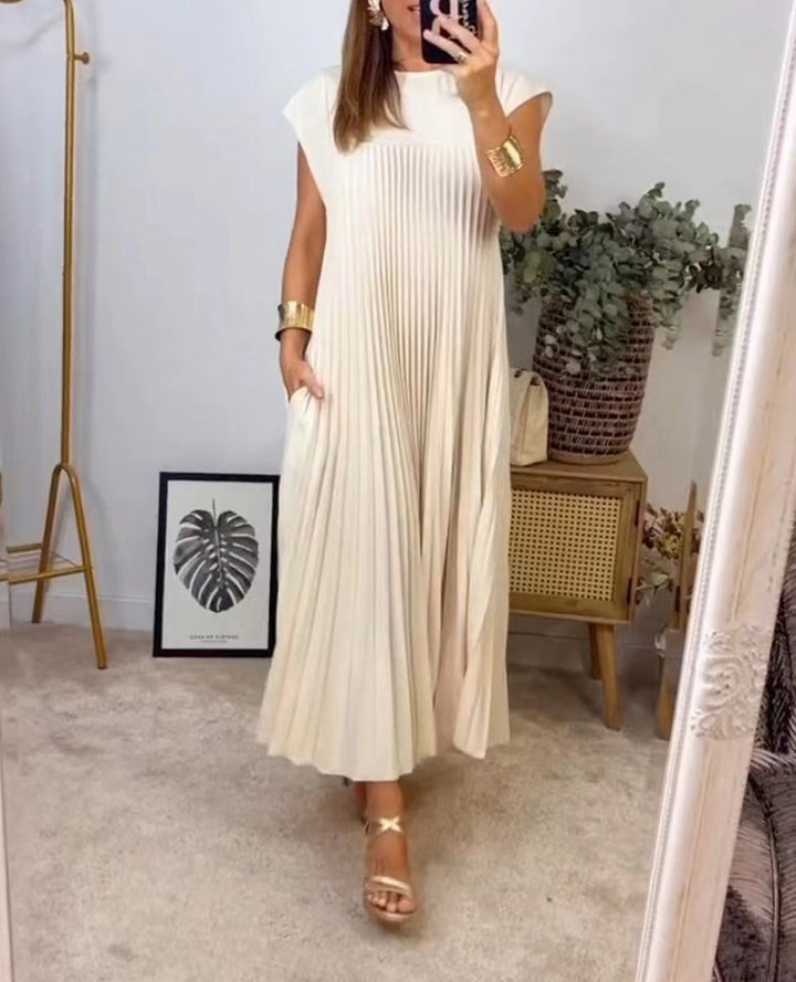 Women's flowing pleated maxi dress with dropped shoulders and side pockets StylebySassy