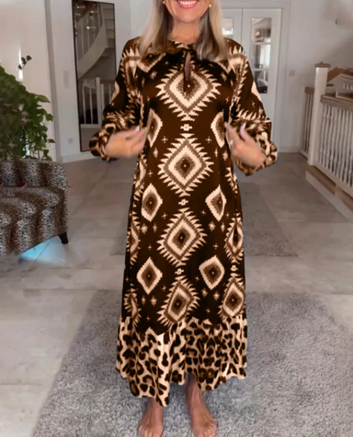 Women's flowing maxi dress with ethnic diamond print, keyhole neckline and contrast ruffle StylebySassy