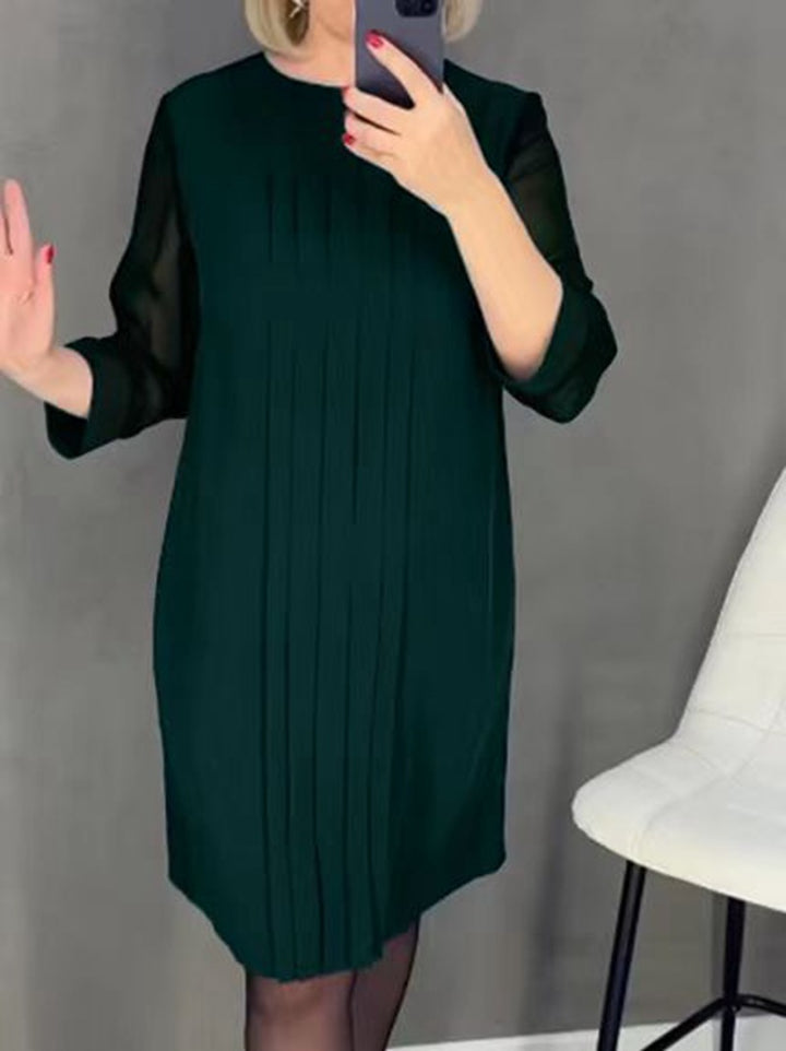 Ladies nan pleated sheath dress with knee-length silhouette and transparent three-quarter sleeves StylebySassy