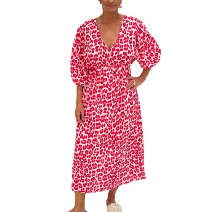 Women's maxi dress with deep V-neck, voluminous puff sleeves, and smocked waist seam StylebySassy