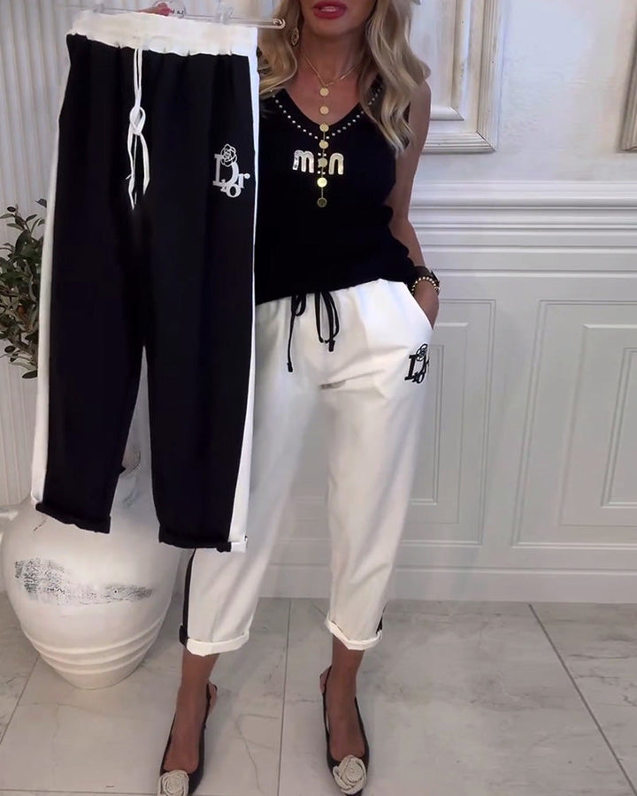 Women's cropped comfort joggers with side contrast stripes, elastic drawstring waist, and logo embroidery StylebySassy