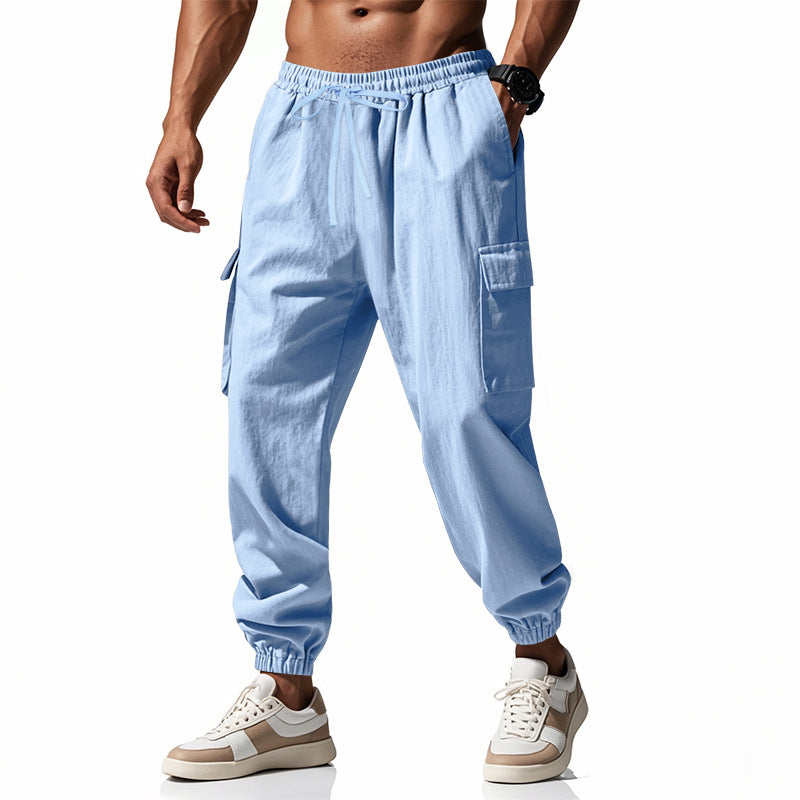 Men's tapered joggers in utilitarian style with elastic waistband, drawstring, and flap pockets StylebySassy