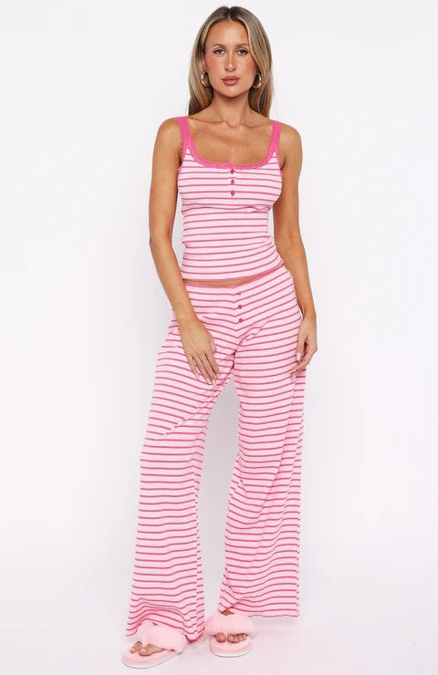 Women's pajama set with decorative button details and striped pattern StylebySassy