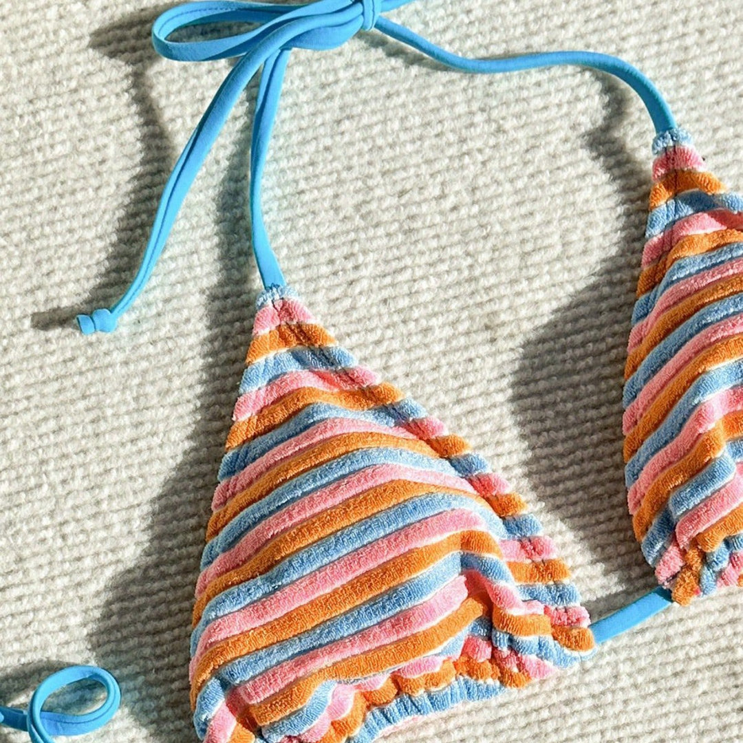 Women's bikini model with playful striped pattern StylebySassy