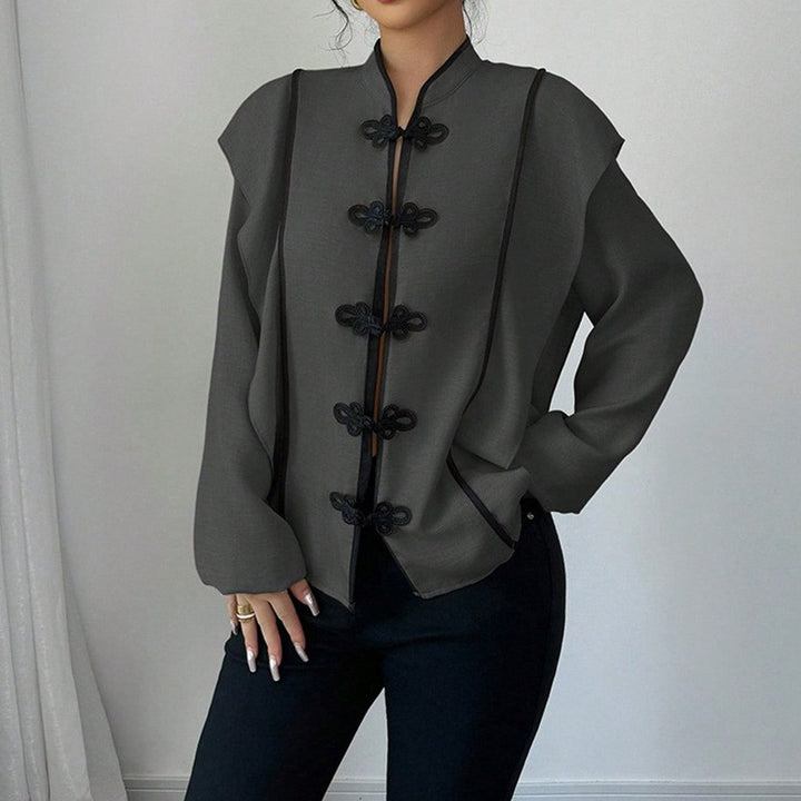 Women's stand-up collar blouse with decorative knot closures and decorative piping StylebySassy