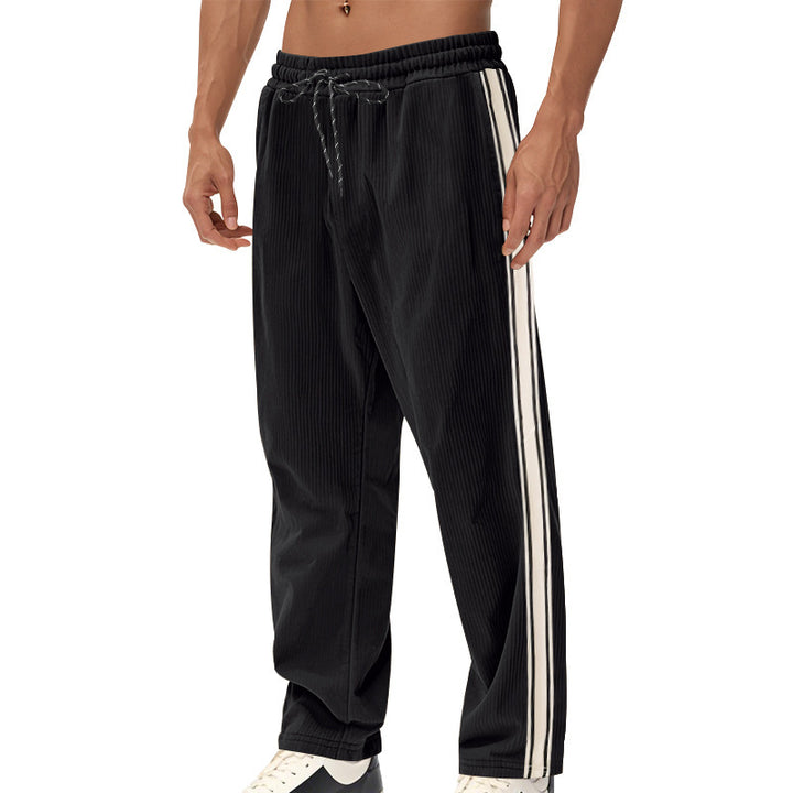 Men's loose training pants in corduroy look with drawstring waistband and side contrast stripes StylebySassy
