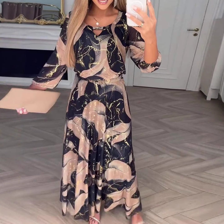 Ladies' maxi dress with abstract marble print, chiffon overlay, keyhole neckline and elastic waist yoke StylebySassy