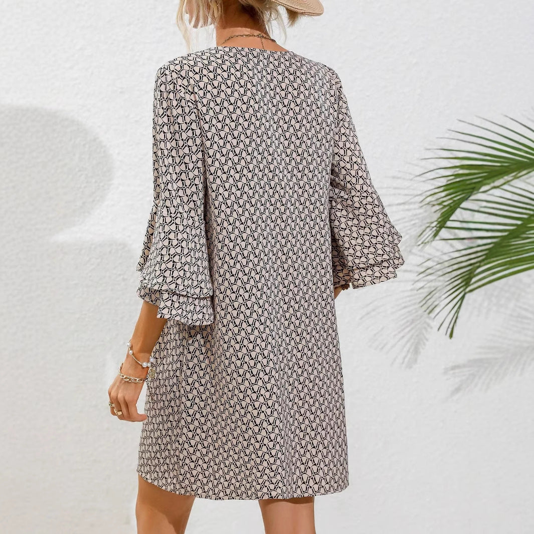 Women's flowing tunic mini dress with V-neck graphic chain pattern and double-layered bell sleeves StylebySassy