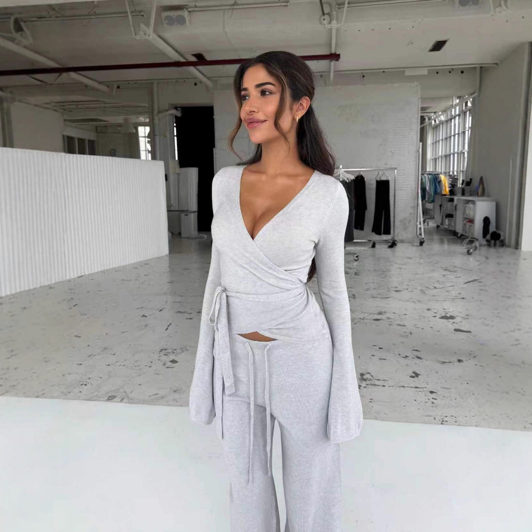 Women's knitted wrap top with tie belt and trumpet sleeves, as well as high-waisted wide-cut knitted pants StylebySassy
