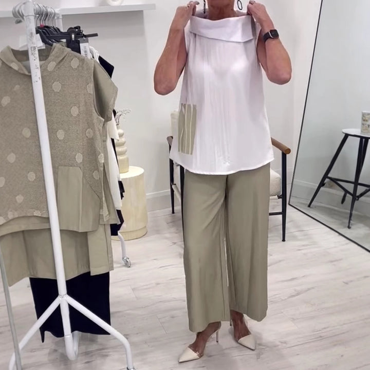 Women's sleeveless blouse top with wide shawl collar, relaxed A-line and side decorative yoke StylebySassy