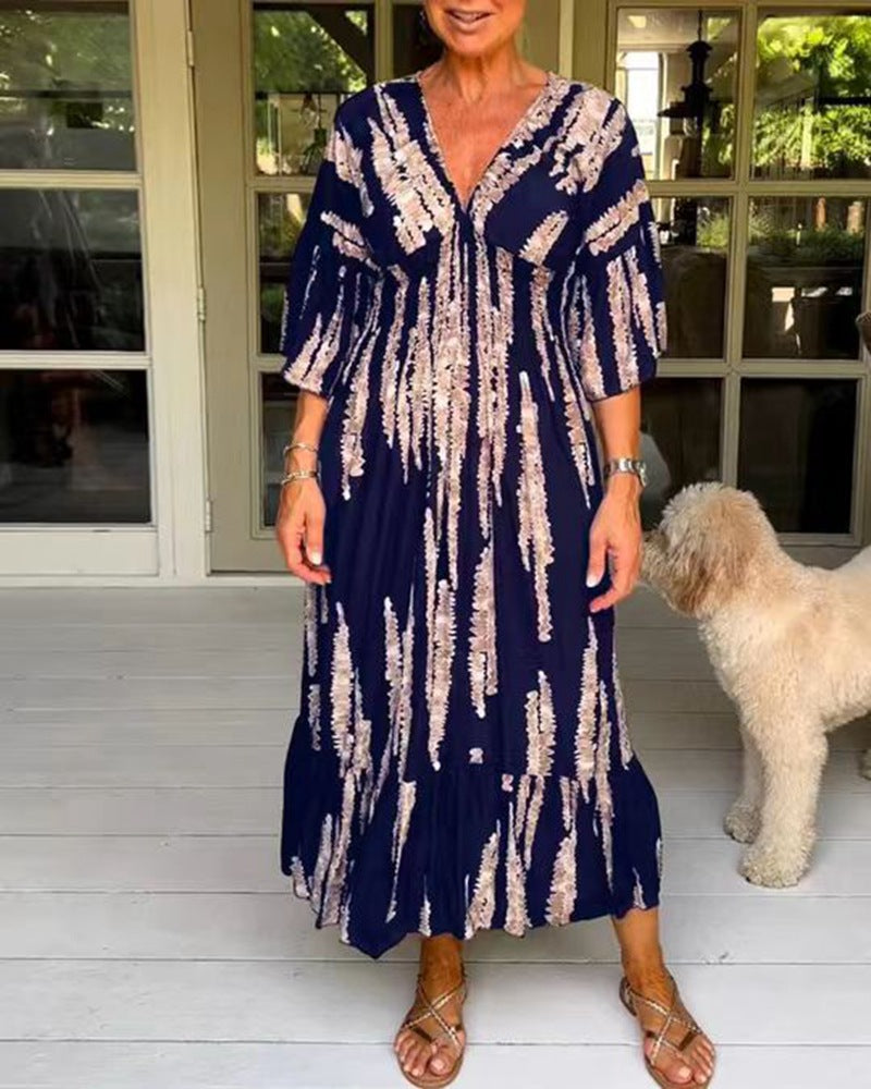 Ladies' V-neck maxi dress with brushstroke pattern, gathered underbust, balloon sleeves, and ruffled tiers StylebySassy