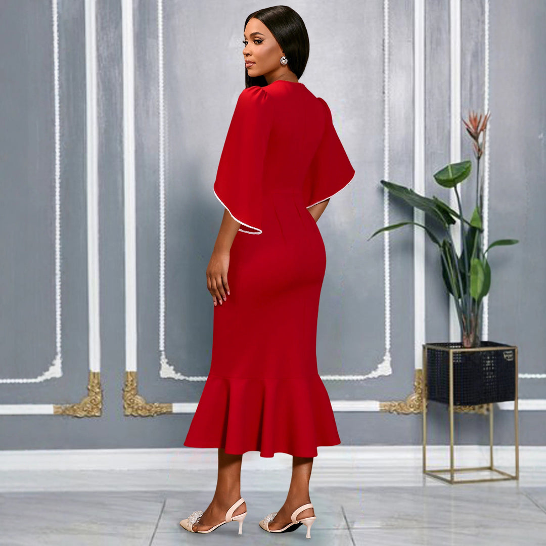 Ladies fitted evening dress with peplum and voluminous ruffle design StylebySassy