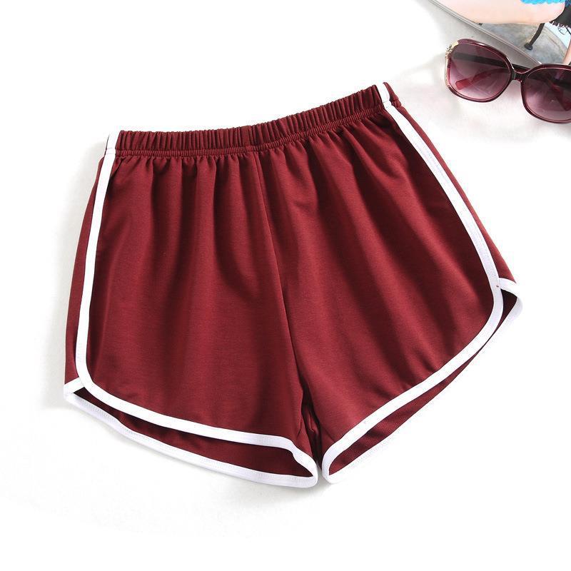 Women's sporty shorts with elastic waistband and contrasting stripes StylebySassy