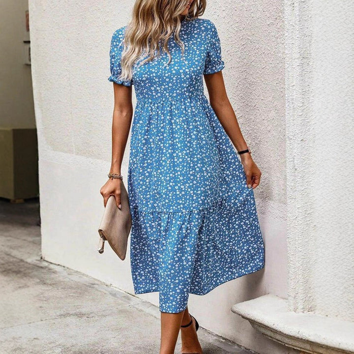 Women's airy midi dress with all-over floral pattern, gathered waist seam and short puff sleeves StylebySassy