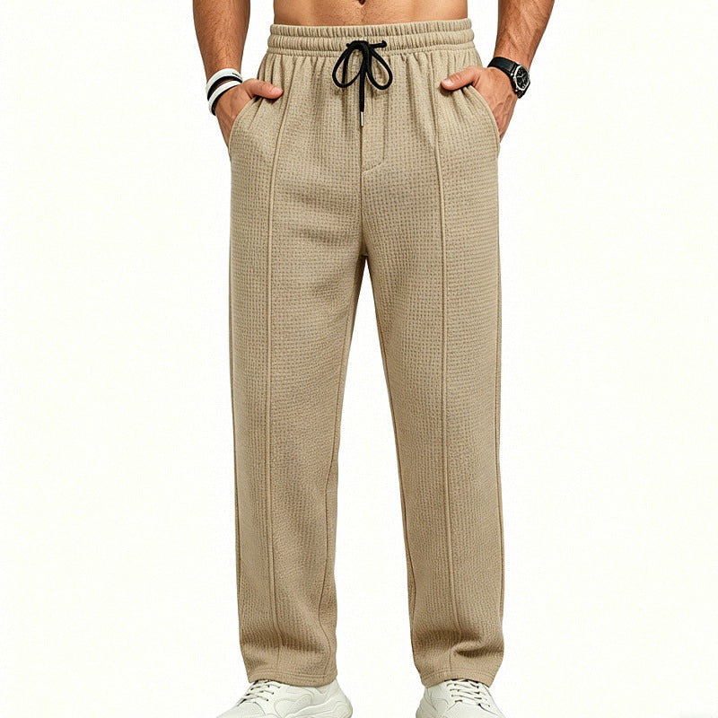 Men's straight-cut relaxed trousers with decorative center seam, elasticated drawstring waistband and side pockets StylebySassy