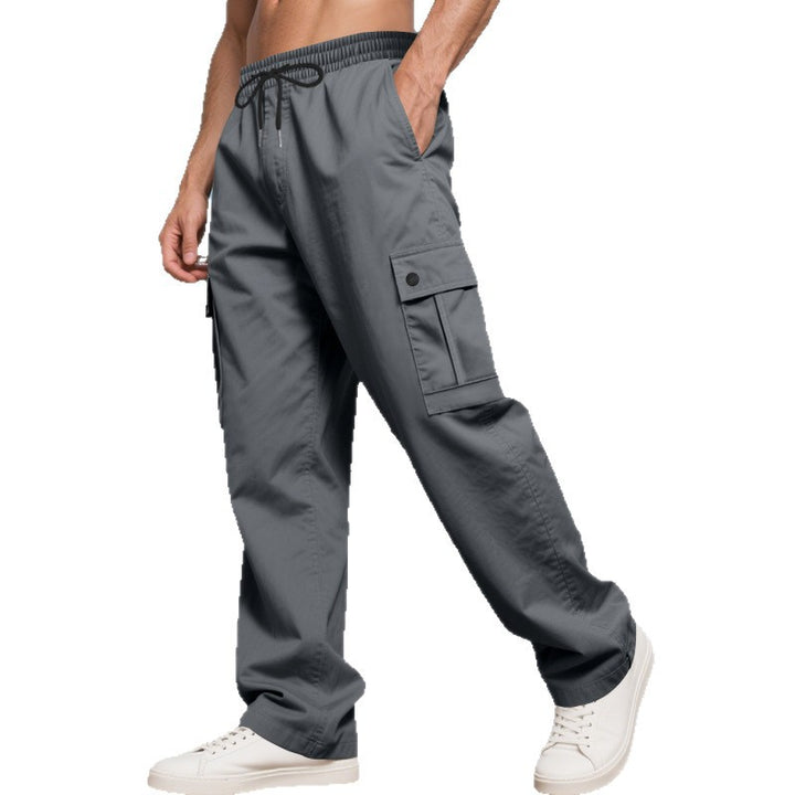 Men's wide cargo pants with elastic drawstring waistband, patch flap pockets, and relaxed fit StylebySassy