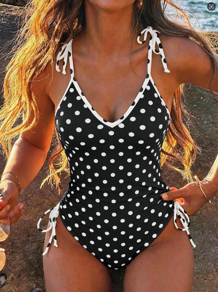 Women's one-piece swimsuit with playful polka dot design StylebySassy