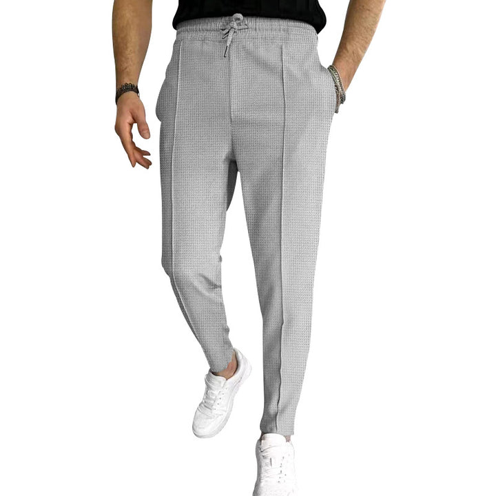 Men's tapered jogging chinos made of structured woven quality with elastic drawstring waistband and decorative crease StylebySassy