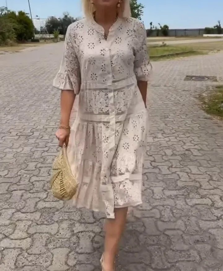 Women's romantic midi dress with broderie anglaise, buttoned top, stand-up collar, half-length flounce sleeves, and tiered hem StylebySassy