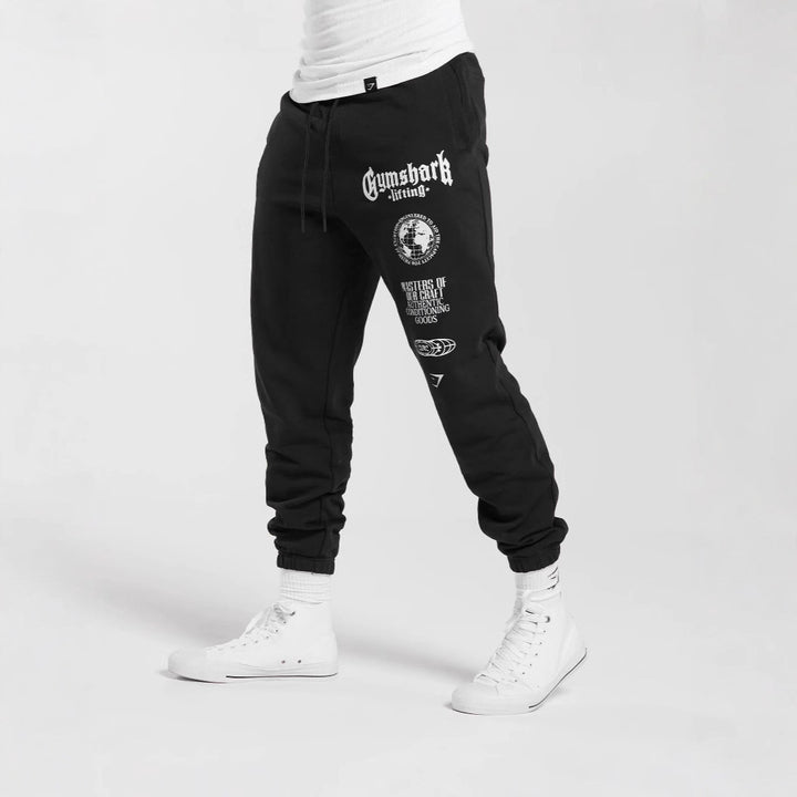 Men's tapered cotton fleece sweatpants with an elastic drawstring waistband, ribbed leg openings, and large logo print StylebySassy