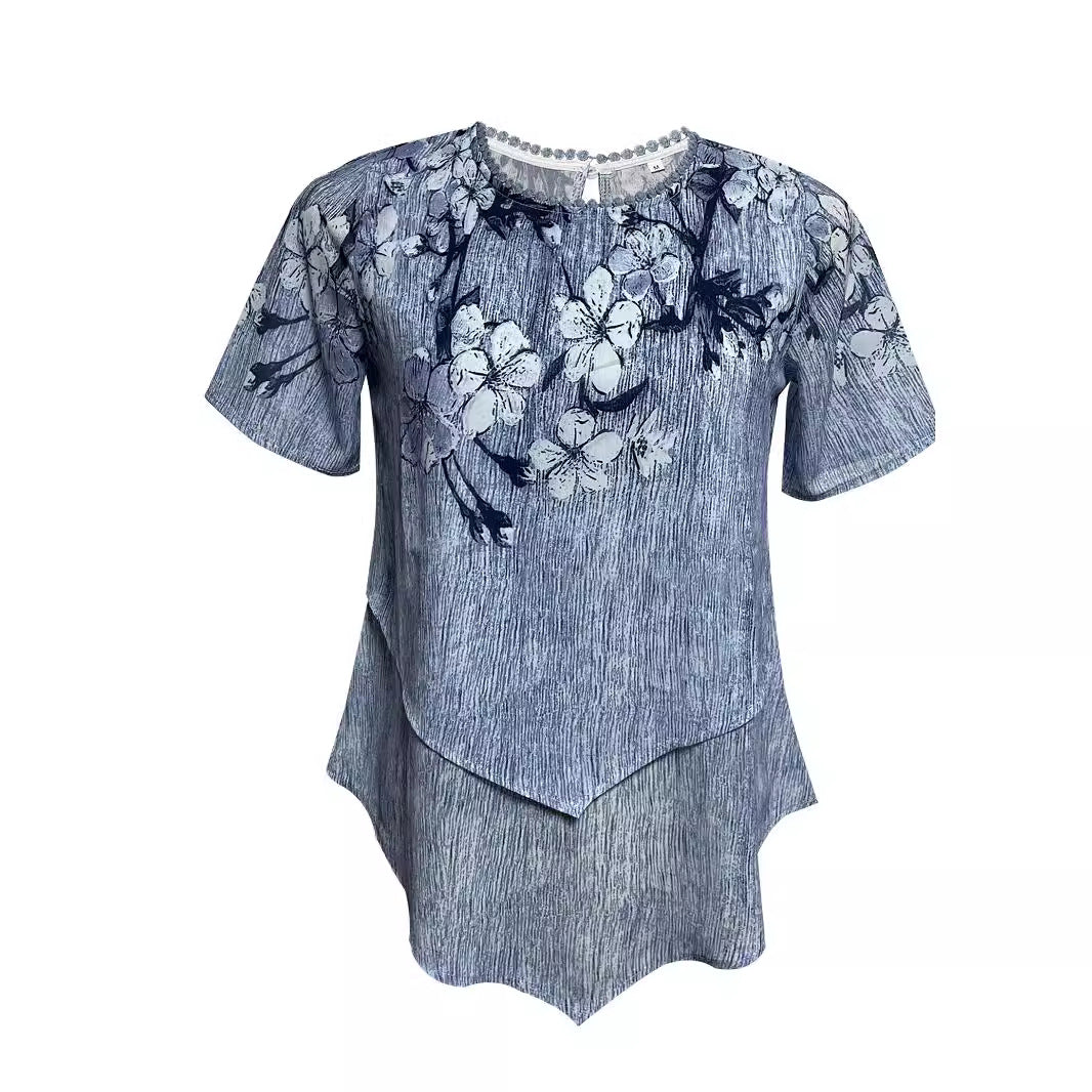 Women's two-layer blouse dress with asymmetrical tiered hem, floral print yoke, and wing sleeves StylebySassy